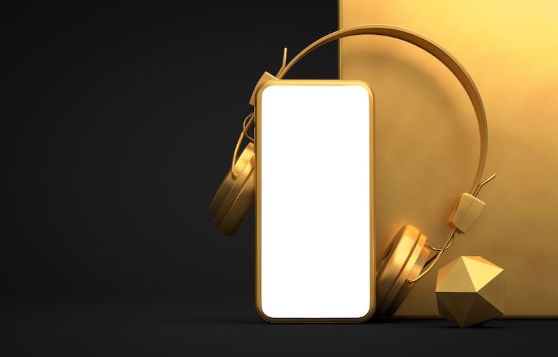 Mobil med guld hörlurar